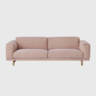 Muuto Rest 3 seater sofa in pink upholstery on a light grey background.