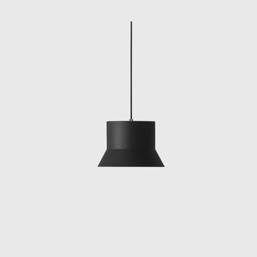 A minimalist black pendant light with a wide, flared conical shade and a thin vertical hanging rod, shown against a solid light gray background.