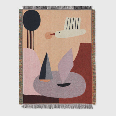 Bird tapestry blanket with fringing detail on a light grey background.