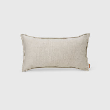 Off white woven cushion on a light grey background 